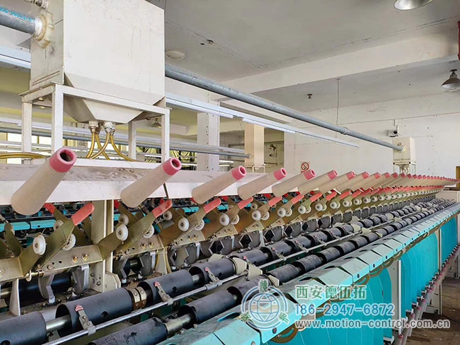 图为由编码器调节张力的关纱机照片